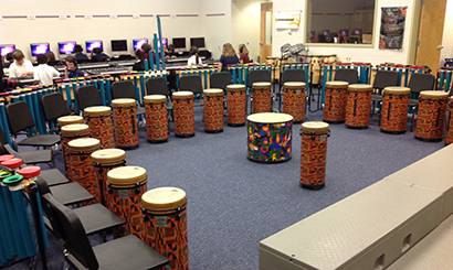 Group of kids playing Joia Tubes with other instruments
