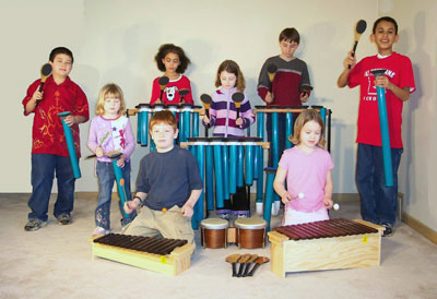 Group of kids playing Joia Tubes with other instruments